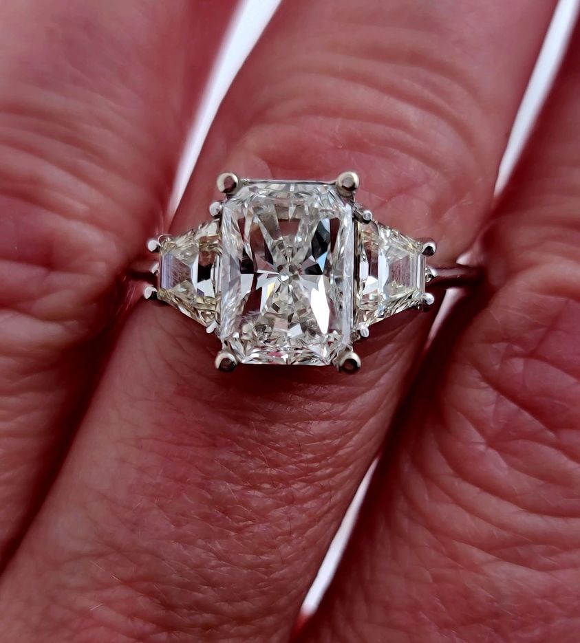 3.39 carats tw with long Radiant Cut Diamond