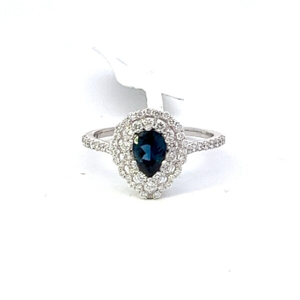 This is a .66 carat Pear Shaped cut natural mined Blue Sapphire that set in 14 kt white gold setting with full cut round natural diamonds with an additional total weight of .48 carats total weight. Total of all gemstones that equals 1.14 carats.