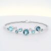 14K WG Bangle w/ 3.95 tw. of Round Blue Topaz & .11 tw. of Diamonds
