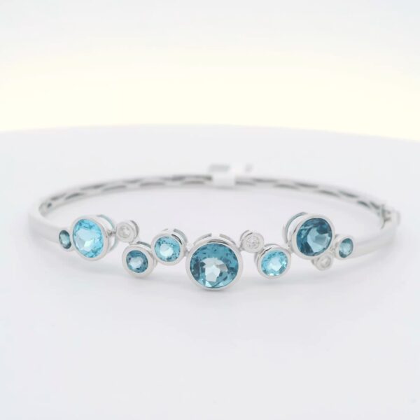 14K WG Bangle w/ 3.95 tw. of Round Blue Topaz & .11 tw. of Diamonds