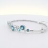 14K WG Bangle w/ 3.95 tw. of Round Blue Topaz & .11 tw. of Diamonds