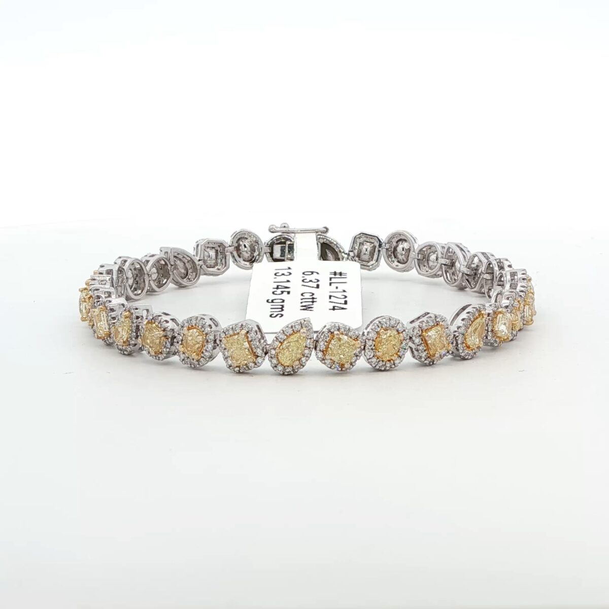 14K WG Diamond Tennis Bracelet w/ Mixed Shape Fancy Yellow Diamonds surrounded by Round Brilliant White Diamonds (6.37 cttw.)
