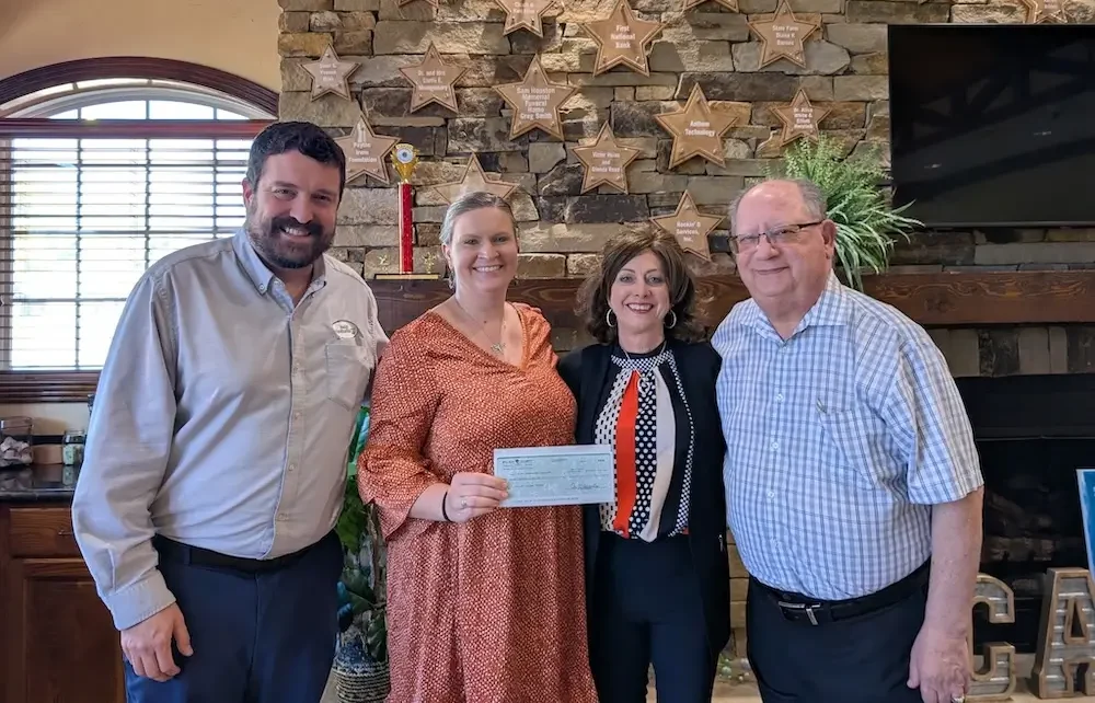 Elliott Herzlich (right) of Elliott's Jewelers in Huntsville, TX pictured at CASA event