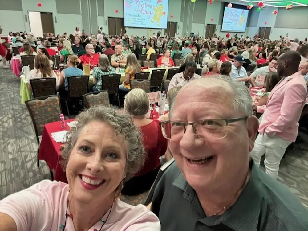 Elliott Herzlich and Laura Green at CASA Christmas in July 2025 event