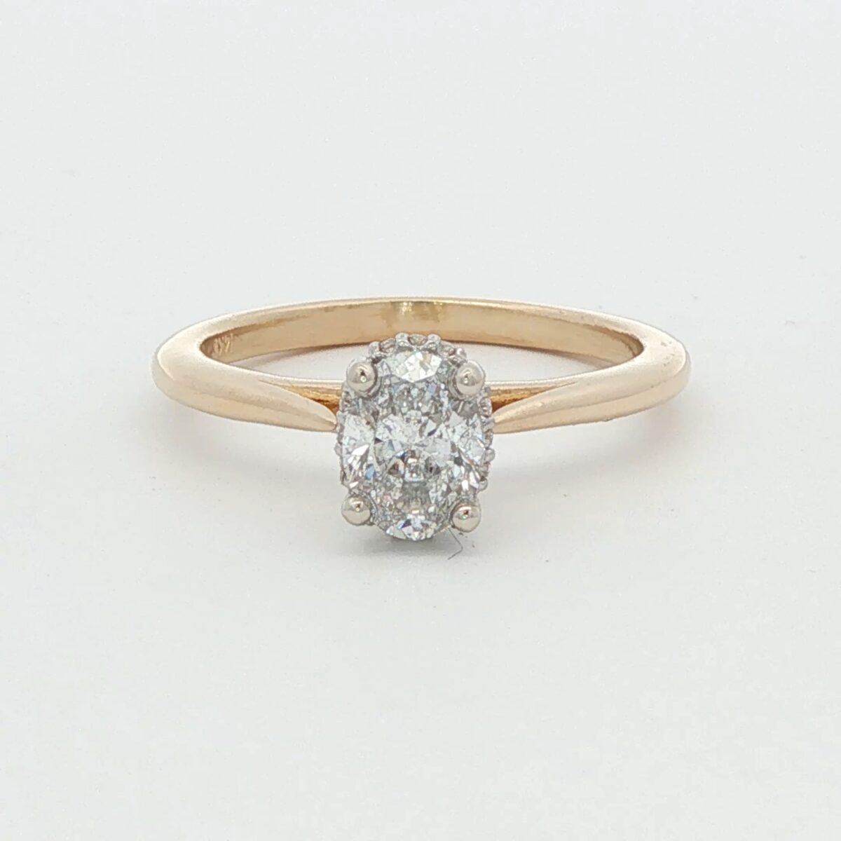 14K YG Cathedral Style Solitaire Engagement Ring w/ .70 ct. Oval Center and .04 tw. Hidden Halo