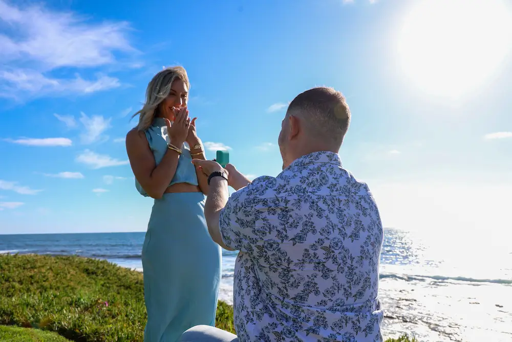 Devin proposing to Casey on the beach in San Diego