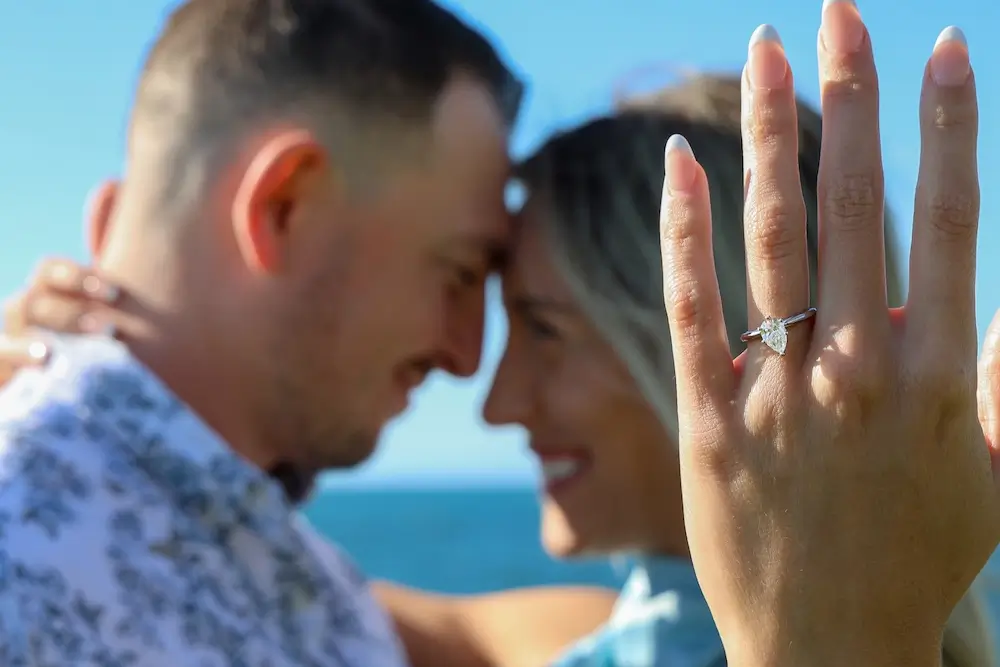 Devin & Casey hugging, engagement ring on Casey's ring finger