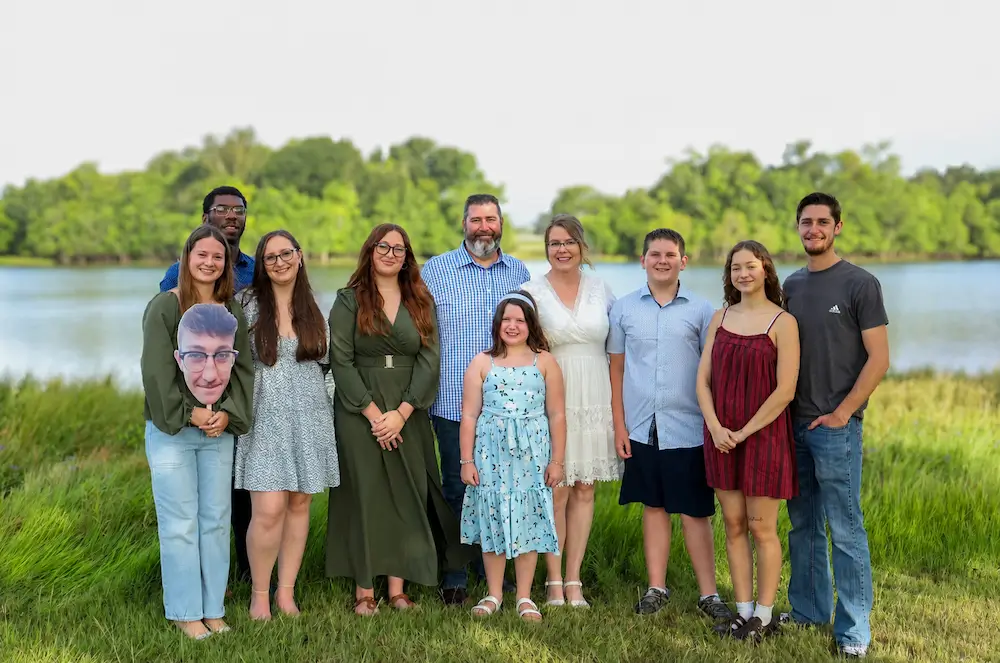 Jenni and Jay pictured with family on their wedding day