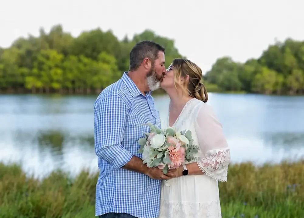 Jenni & Jay kissing after exchanging wedding vows
